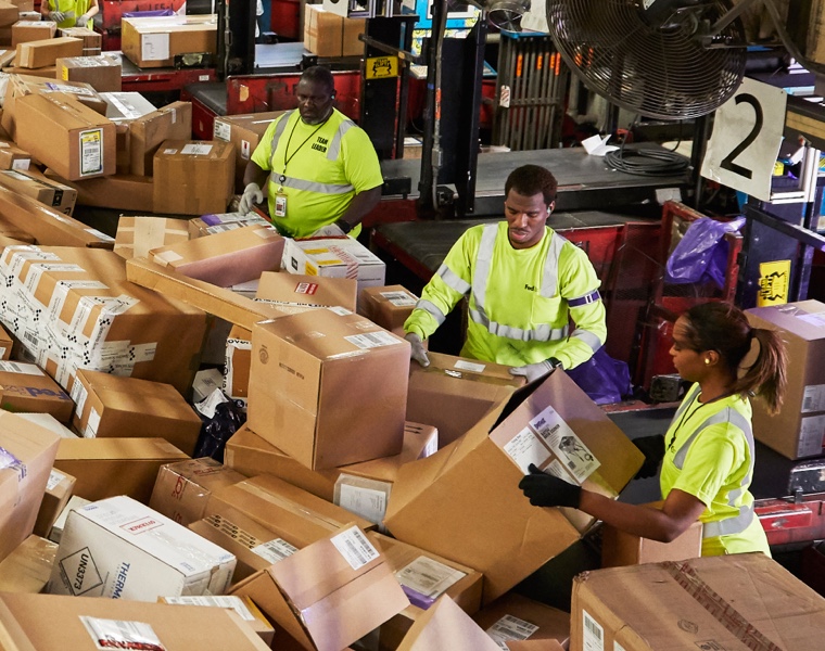 Team Members holding packages