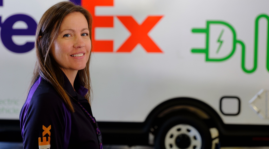 FedEx Employee standing in front of van